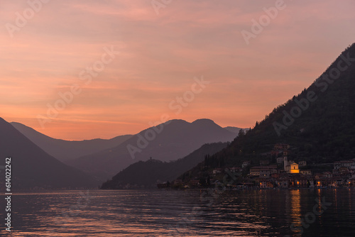 Fototapeta Naklejka Na Ścianę i Meble -  View of Iseo during sunset with the mountains in the background