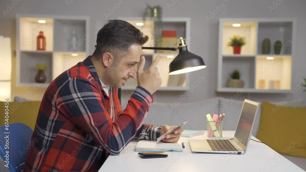 The man who sees the money account on his laptop. The man who sees the money account on his laptop.