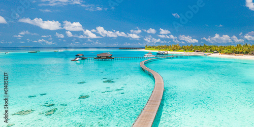 Best aerial Maldives paradise. Tropical aerial landscape photography. Seascape long pier bridge, water villas amazing sea bay lagoon beach. Exotic nature tourism destination. Panoramic summer vacation photo