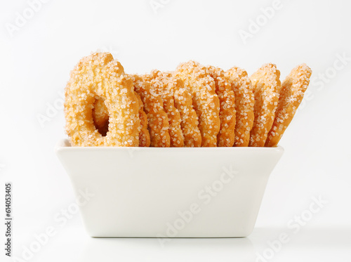 ring shaped cookies topped with granulated sugar