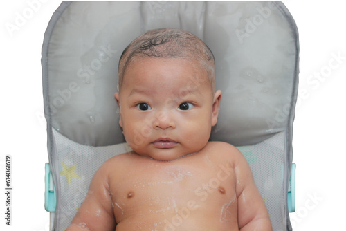 4 month old Asian baby boy having bath in tubby isolated. photo