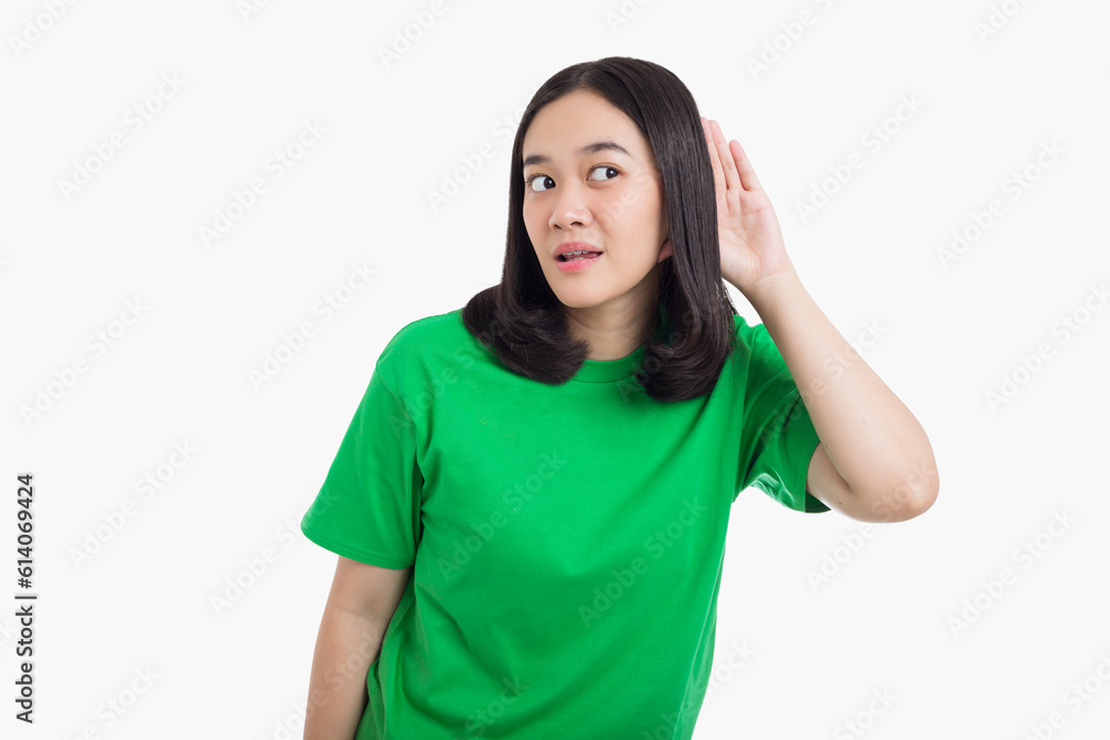 Young Asian woman puts a hand over ear listening conversation or something Young Asian woman puts a hand over ear listening conversation or something
