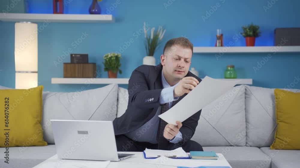 Home office worker man working seriously and focused. Home office worker man working seriously and focused.