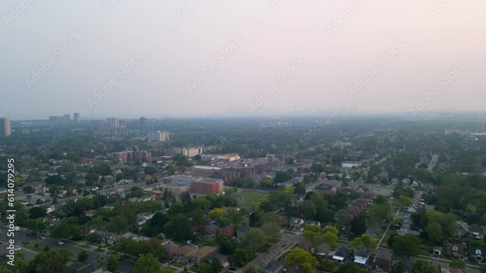 Toronto city skyline masked by heavy wildfire smoke from forest fires caused by global warming climate change Toronto city skyline masked by heavy wildfire smoke from forest fires caused by global warming climate change