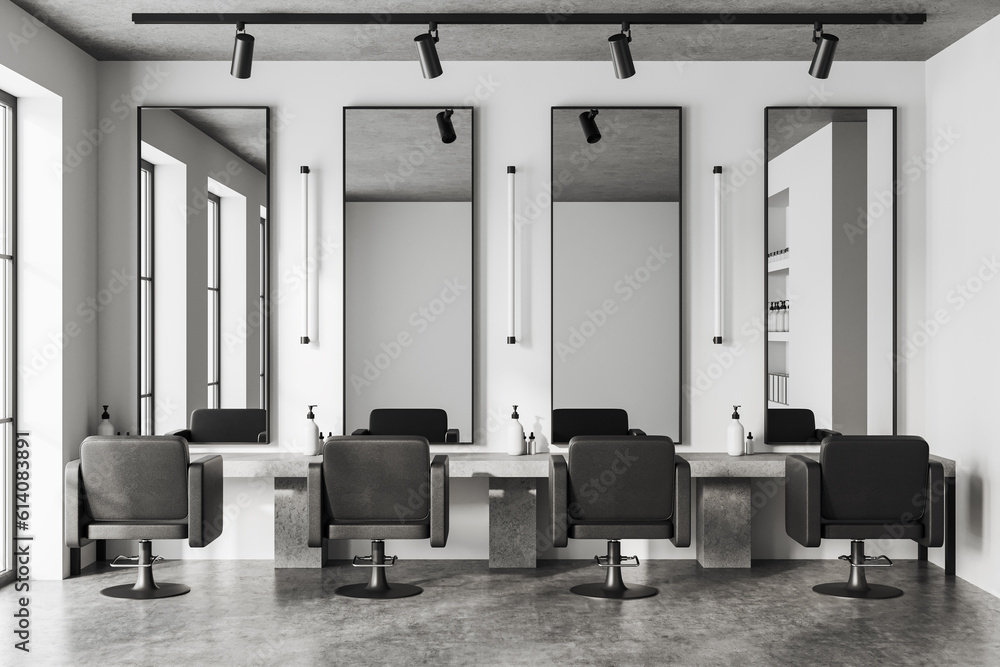 Fototapeta Light stylish barber shop with armchairs in row and mirror, accessories on table