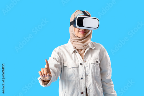 Young Arabian woman with VR...
