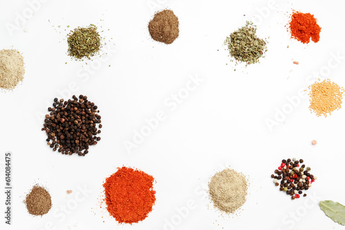 Frame made of fresh aromatic spices on light background