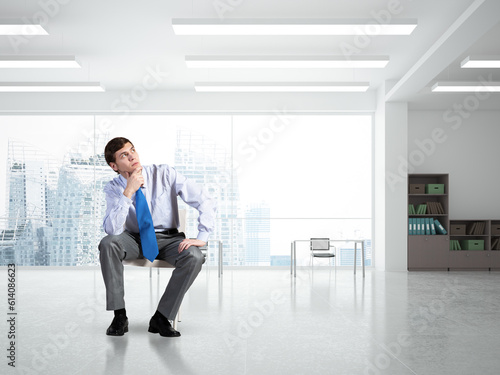 Young businessman sitting on an office chair