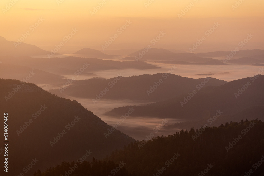 Layers of the hills during morning mist on Bijele stijene mountains, Croatia