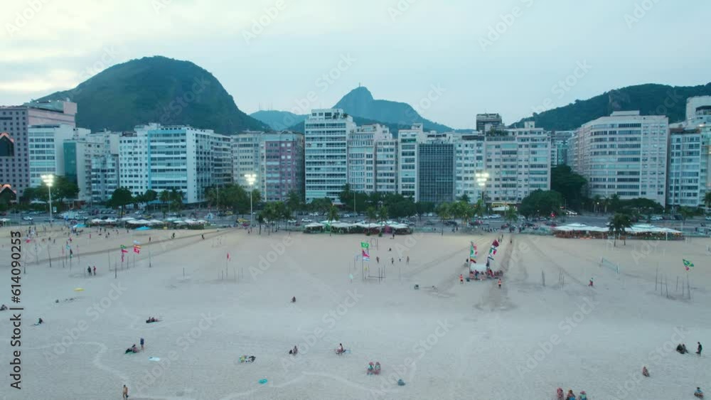 Copacabana beach during blue hour aerial view flying over sandy beach towards coastal hotels under Sugarloaf mountain, Brazil Copacabana beach during blue hour aerial view flying over sandy beach towards coastal hotels under Sugarloaf mountain, Brazil