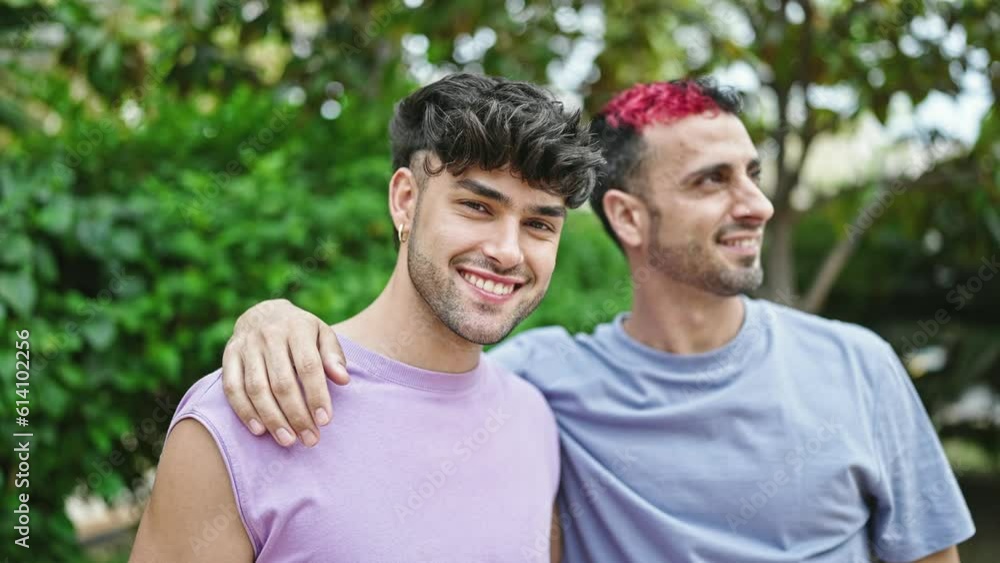 Two men couple smiling confident hugging each other at park Two men couple smiling confident hugging each other at park