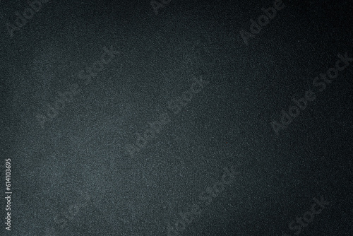 Dark textured black and gray background. Free space for text. Top view.