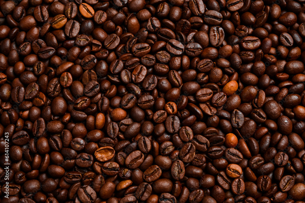 Fototapeta premium Background of roasted coffee beans. Macro photo. Free space for text. Top view.