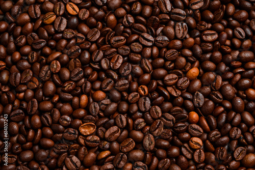 Background of roasted coffee beans. Macro photo. Free space for text. Top view.