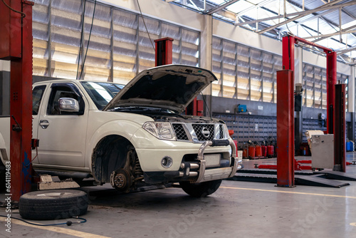 car repair in garage service station with soft-focus and over light in the background