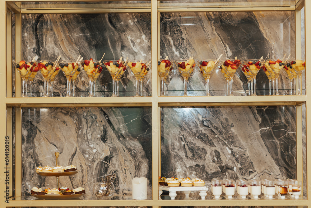 Candy bar for party. Festively met guests with different desserts. Wedding. Reception.