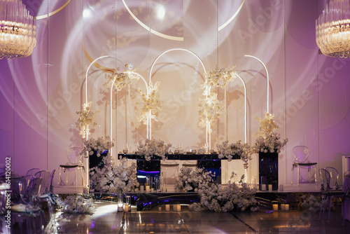 Wedding banquet decoration in delicate color. Classic, light and luxury wedding tables decorations, the festive table setting with candles.	
