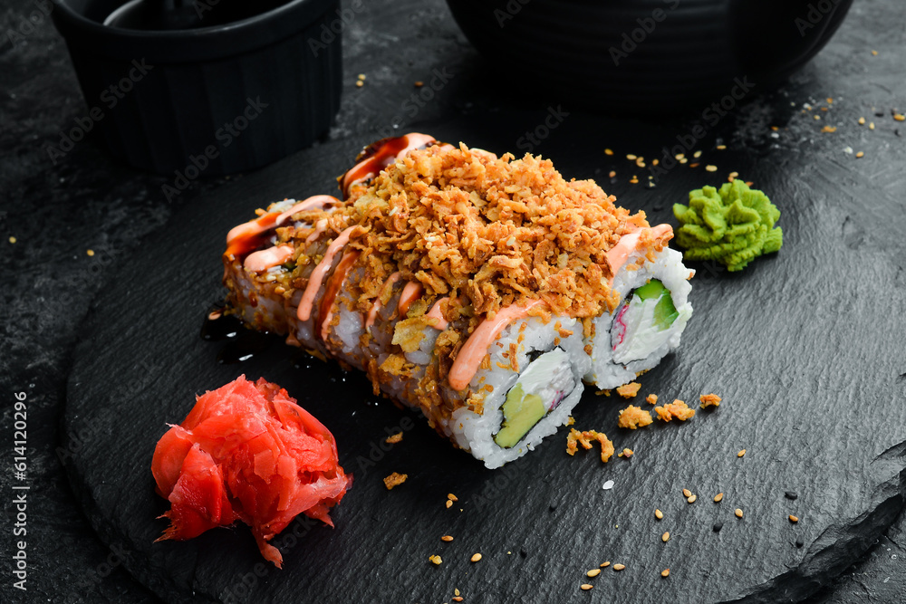 Traditional sushi rolls on a stone plate. Close-up. Sushi menu. Japanese food. Traditional sushi rolls on a stone plate. Close-up. Sushi menu. Japanese food.