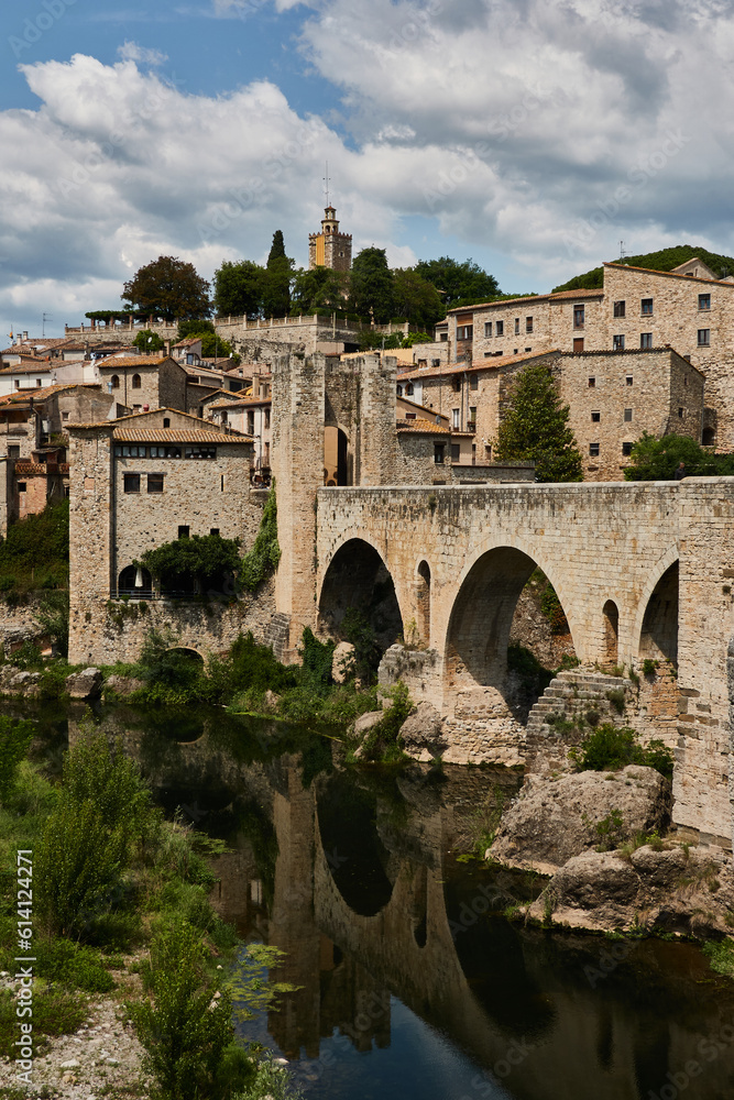The Besalú bridge is a Romanesque bridge with arches and defensive towers built in the Middle Ages. Girona. Catalonia. Spain
