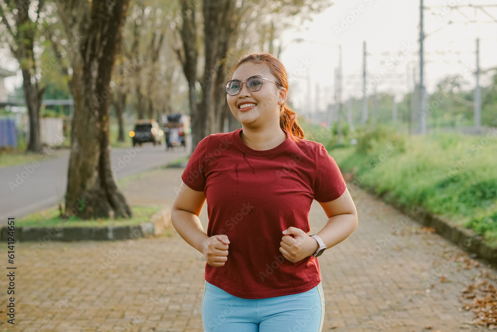 asian woman running and exercising outdoors excitedly asian woman running and exercising outdoors excitedly