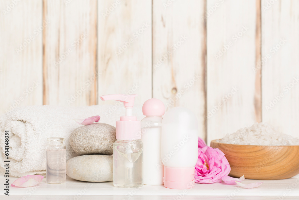 Spa composition with pink roses on wooden table Spa composition with pink roses on wooden table