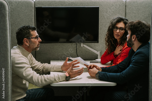 Photos A gorgeous business girl apologizing to her partner for the mistake she did at t
