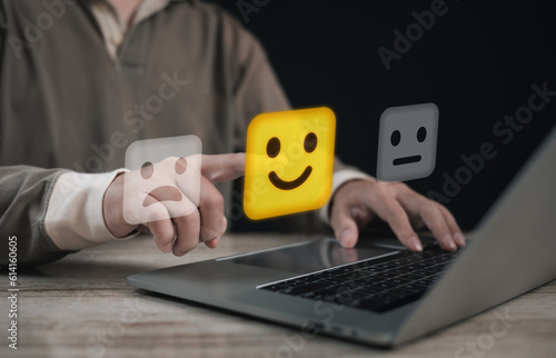 Concept of satisfaction and customer service. : Business man use use laptop touching or pressing the virtual screen Five score and five star to show satisfaction with the service or give rate. 
