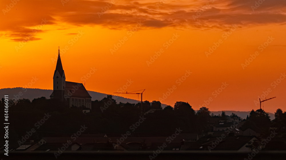 Sunrise with a church silhouette near Hengersberg, Bavaria, Germany