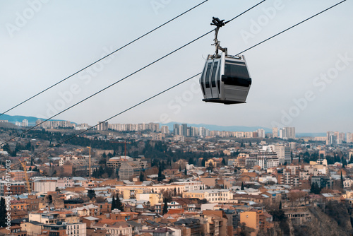 cable car rope way over Georgian capital Tbilisi, aerial of historical district