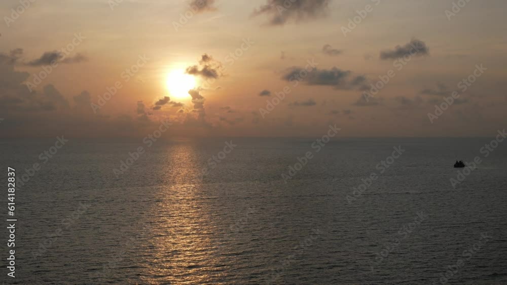 Sunrise over calm ocean open sea in aerial view.Dawn over horizon ocean tropical golden sunrise over ocean water. Sun rise reflection on seascape. Calm waterscape at sunrise Sunrise over calm ocean open sea in aerial view.Dawn over horizon ocean tropical golden sunrise over ocean water. Sun rise reflection on seascape. Calm waterscape at sunrise