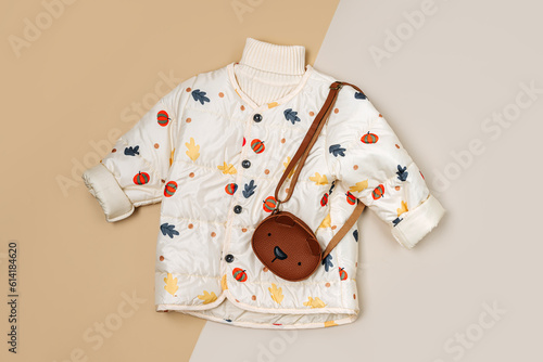 Stylish children's autumn warm jacket, knitted sweater with cute bag. Fashion kids outfit for for spring, autumn or winter. Flat lay, top view