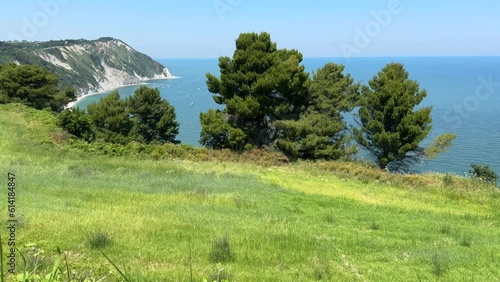 View of Adriatic sea bay and blossoming Spiaggia Mezzavalle beach near Portonovo and Ancona towns in the Marche region. Italy, Conero Riviera photo