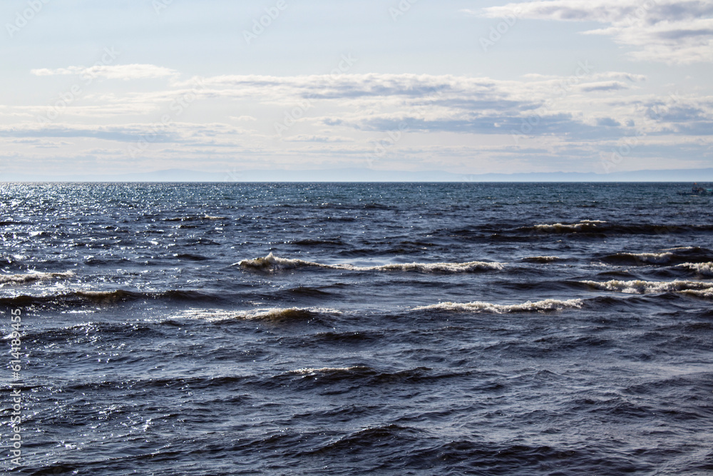 Lake Baikal shore with fresh water waves