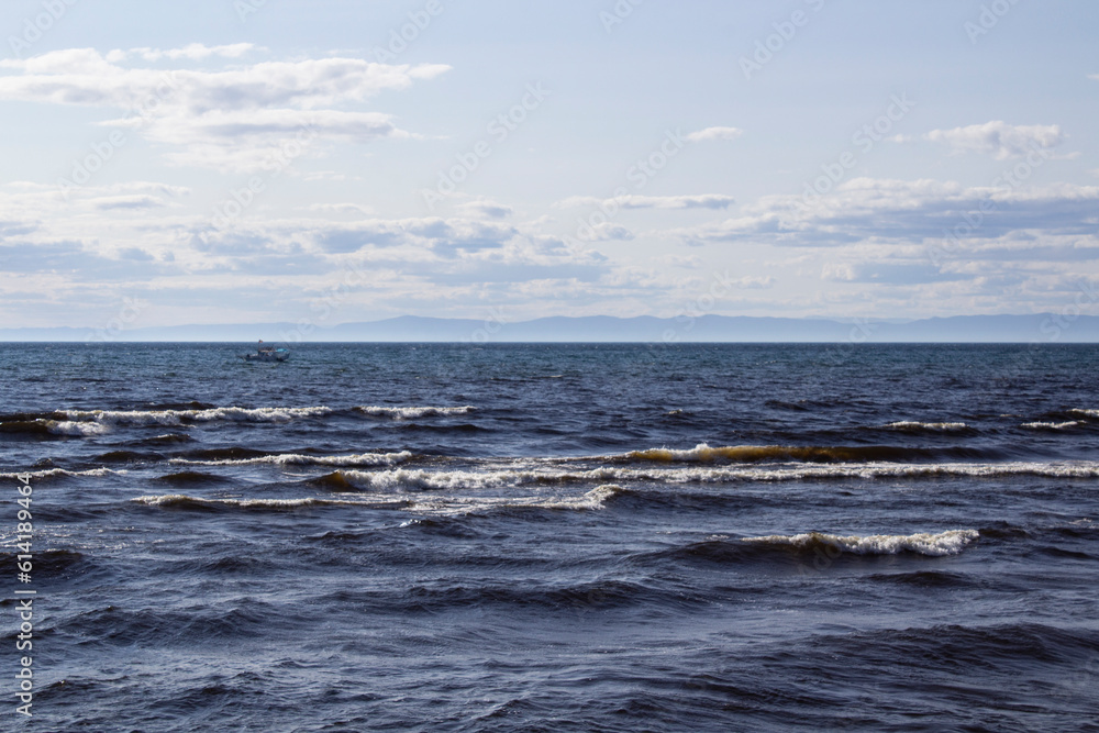 Lake Baikal shore with fresh water waves