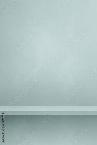 Empty shelf on a light blue concrete wall. Background template. Vertical mockup