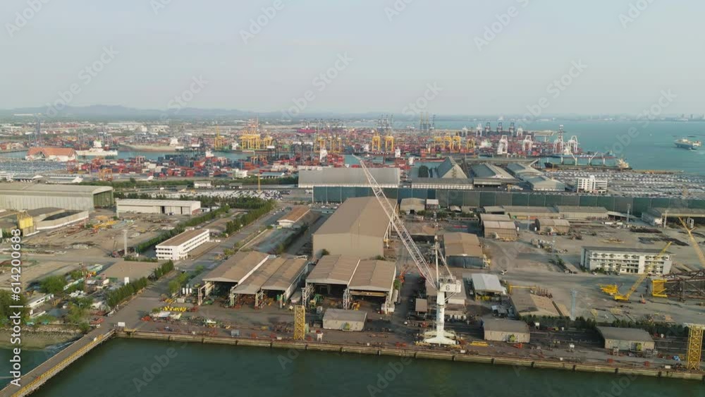 Aerial view of container cargo ship in the export and import business and logistics international goods in urban city. Shipping to the harbour by crane in Bangkok harbour, Thailand. Aerial view of container cargo ship in the export and import business and logistics international goods in urban city. Shipping to the harbour by crane in Bangkok harbour, Thailand.