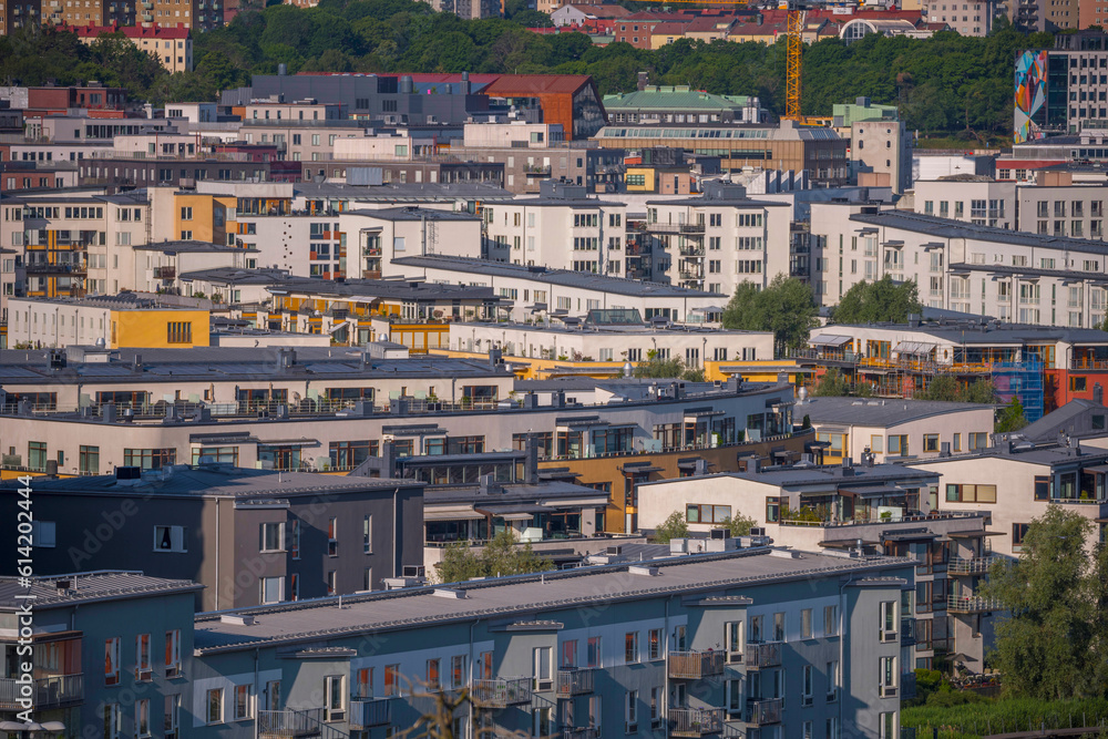 Apartment houses, roofs and balcony facades, a sunny summer morning in Stockholm