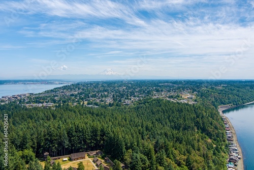 Aerial view of Point Defiance and Mount Rainier from Tacoma, Washington in June