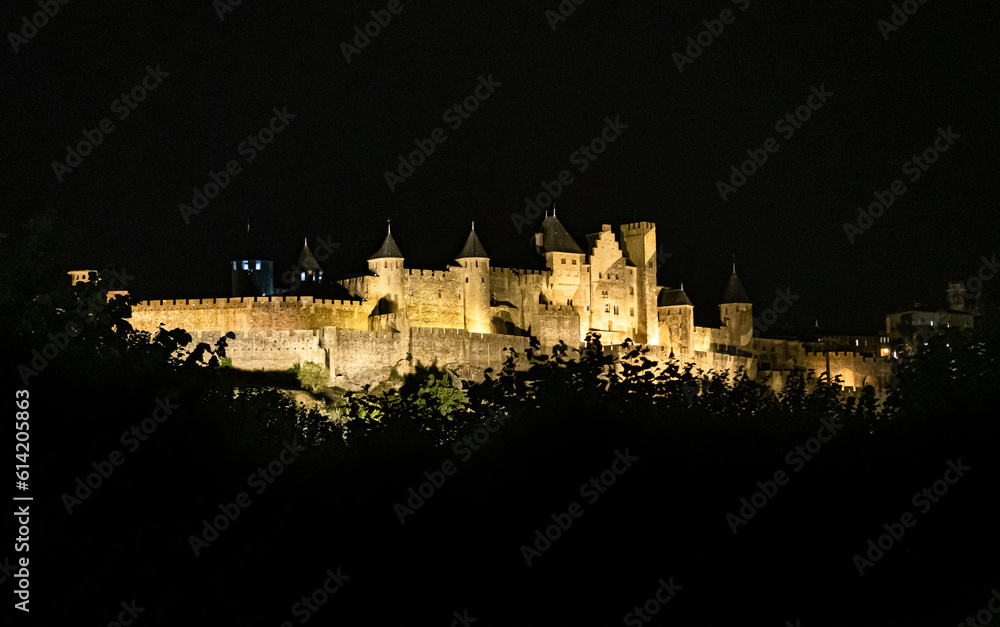 Spectacular Illuminated Ancient Fortress Of Medieval City Carcassonne In The Night In Occitania, France