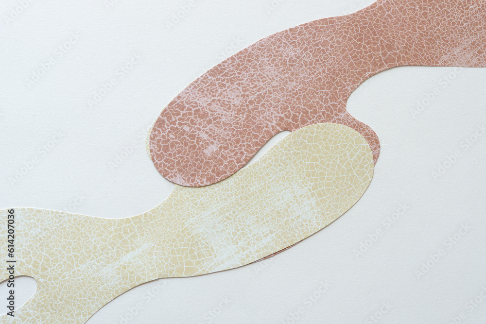 two paper shapes interacting on blank paper two paper shapes interacting on blank paper