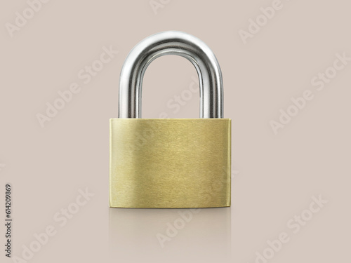 Golden key locked on beige background. concept security photo