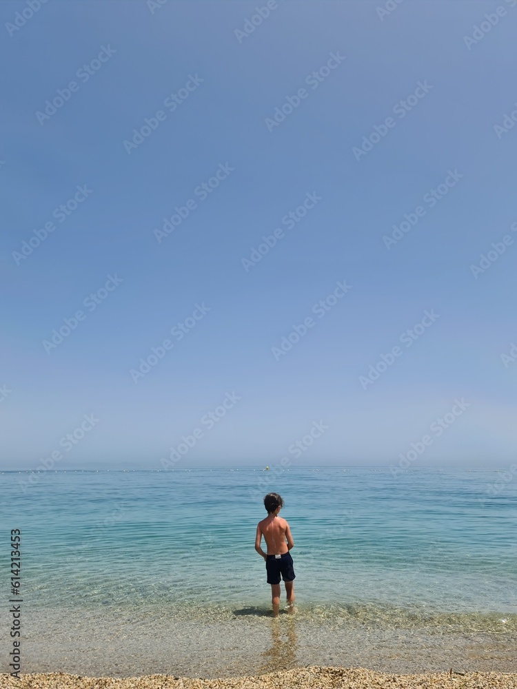 9 yearsold boy alone at the beach