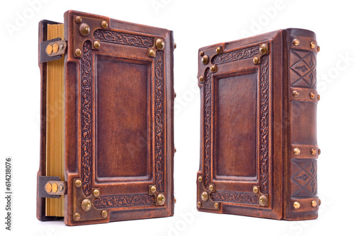 Aged brown right-to-left leather book with metal corners captured isolated