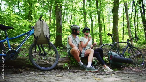 cyclist wearing helmet engaged in sports and recreational bike ride photo