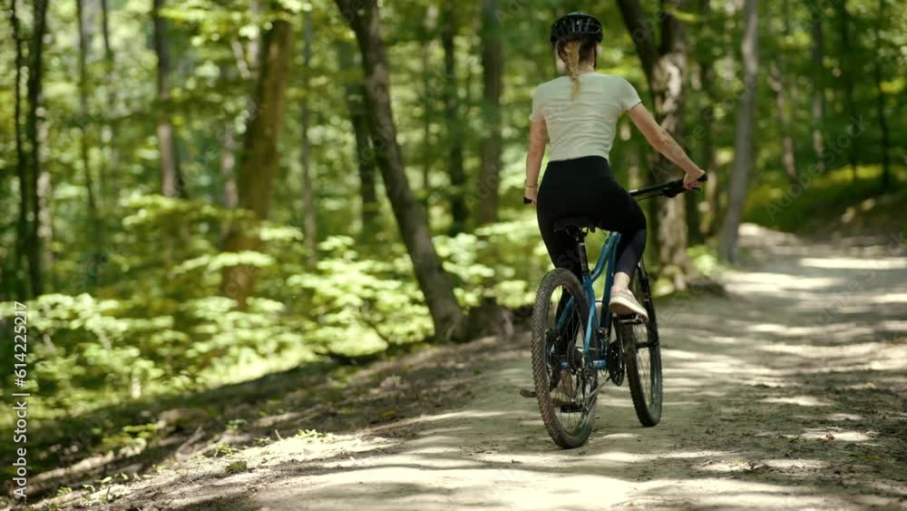 girl in protective gear pedals bike for fitness or fun girl in protective gear pedals bike for fitness or fun