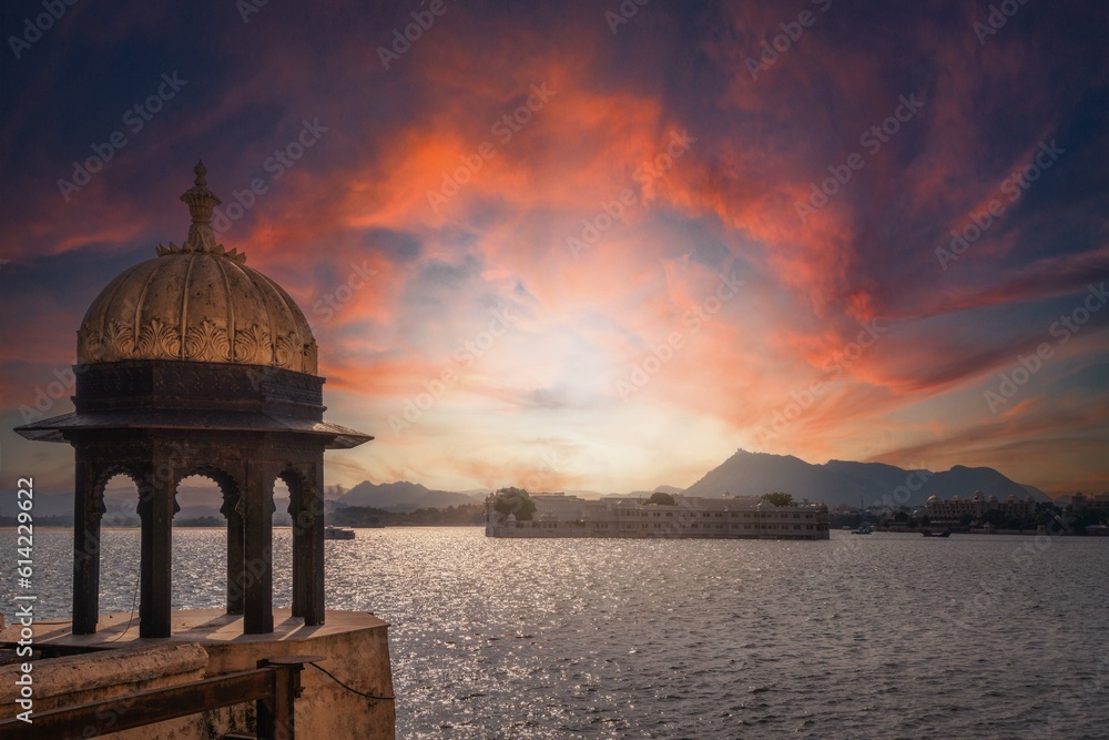 Lake Pichola and  cenotaphs of Taj Lake Palace at amazing sunset. Udaipur, Rajasthan, Discover the beauty of India. Open world after covid-19