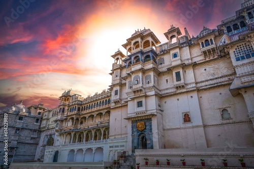 Romantic and luxury City Palace of Maharajah in Udaipur on Lake Pichola at sunset. Rajasthan, Discover the beauty of India. Open world after covid-19