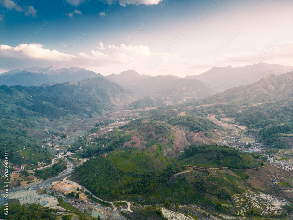 Fototapeta premium The pouring water season makes the terraced fields of Y Ty commune, Lao Cai province, Vietnam appear with brown soil blending with the beautiful sky.
