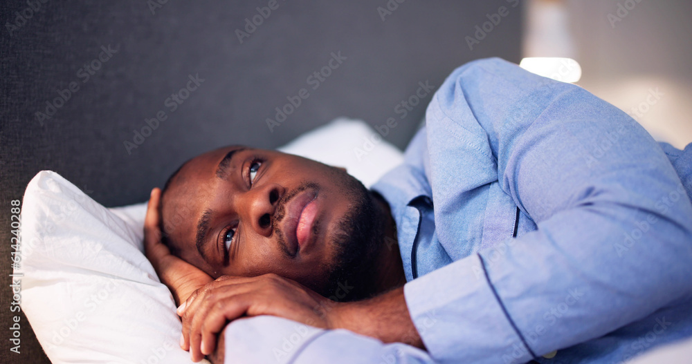 Young African Man Suffering From Fever Lying Young African Man Suffering From Fever Lying