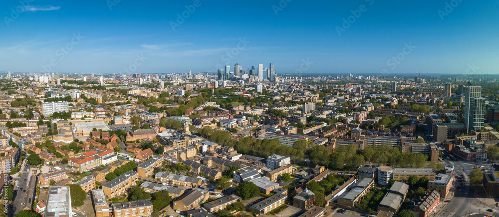 Panoramic aerial view of the city of London center with skyscraper buildings in the background.